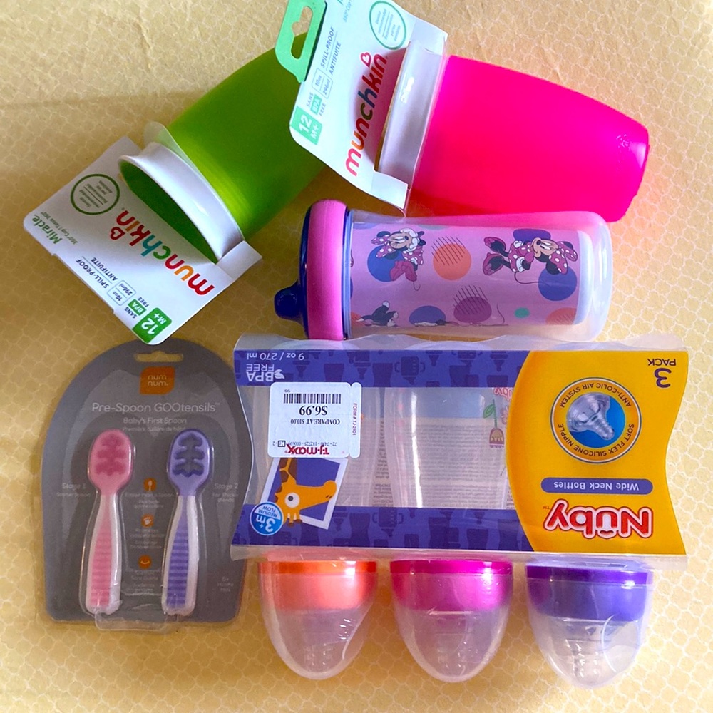 Bundle of new baby stuff,drinking cups ,bottles,spoons and a baby blanket
